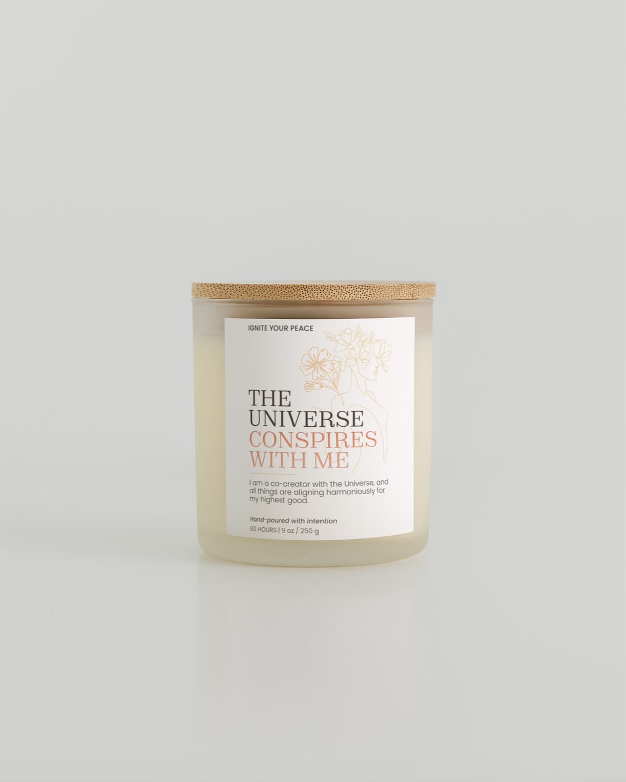 A hand-poured Ignite Your Peace candle on the pouring table